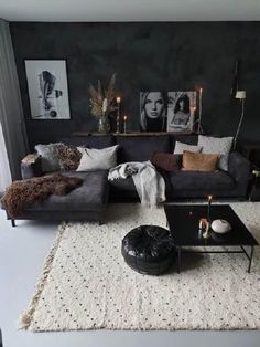 a living room filled with lots of furniture and decor on top of a white rug