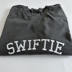 "My absolute favorite tee! Wear it loud and proud; this comfort colors \"SWIFTIE\" tee can be customized with your fave thread color.  Please wash on gentle cycle and dry on low.  If you are wanting a different design, wording, or a different clothing style, please send me a message so we can discuss the details. Please include thread color at checkout" School Spirit Crew T-shirt For Streetwear, Soft-washed Crew Neck T-shirt For College, School Spirit T-shirt With Letter Print, Cotton School Spirit T-shirt, Short-sleeve Cotton Sweatshirt For College, Relaxed Fit Crew T-shirt For College, School Spirit Crew Neck T-shirt With Letter Print, School Spirit T-shirt With Letter Print And Crew Neck, Casual Crew T-shirt For Game Day