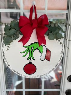 a christmas wreath hanging on the front door