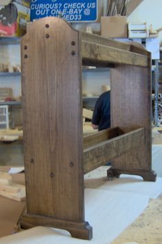 an old wooden bench being worked on in a shop