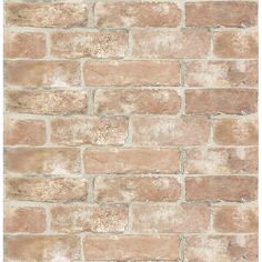 a brick wall that is made out of brown bricks