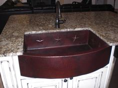 a kitchen sink sitting on top of a counter