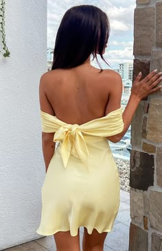 * Yellow Satin Off The Shoulder Mini Dress 
 *  
 * HOW TO STYLE:
  
 * A stunning slip satin dress is perfect for homecoming ()! Paired with classic white heels and beautiful gold jewellery (), you will be out shining everyone! This dress is also the perfect dress for a cocktail event () with the girls!  
 * 
 
 * FEATURES:
  
 * Light weight material 
 * Mini length 
 * Off the shoulder style 
 * Adjustable bow tie detail at back  
 * Satin material 
 * Invisible zip on side hem  
 * Panel fol Off The Shoulder Yellow Dress, Yellow Satin Hoco Dress, Pastel Yellow Mini Dress, Pastel Yellow Dress Short, Yellow Mini Dress Formal, Pale Yellow Hoco Dress, Hoco Dresses Off The Shoulder, Pastel Yellow Hoco Dress, Simple Yellow Dress