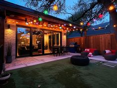 an outdoor patio with lights strung over it