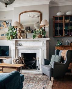 a living room filled with furniture and a fire place