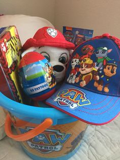 a stuffed animal wearing a hat and other toys