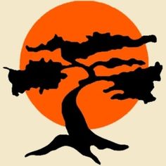 an orange and black tree with the sun in the background