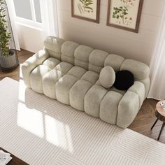 a living room with a couch and rug on the floor