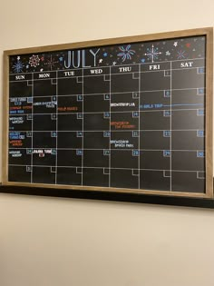 a black and white calendar hanging on the wall