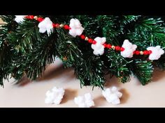 a close up of a fake christmas tree with snow on it