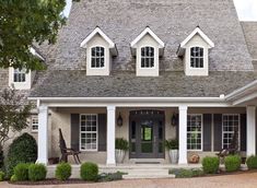 a house with white trim and black shutters