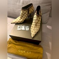 Never Worn Classic Gucci Ankle Monogrammed Boots. 3 Inch Heel Boot Bag Included And Extra Heel Tops. These Are A Timeless Timepiece! Gucci Luxury Ankle Boots, Gucci Designer Ankle Boots, Designer Gucci Ankle Boots, Gucci Luxury Boots, Designer Beige Ankle Boots, Elegant Gucci Pointed Toe Boots, Designer Beige Boots For Evening, Designer Beige High Heel Boots, Designer Beige Boots For Formal Occasions