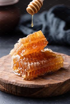 honey dripping from a wooden spoon