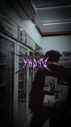 a person standing in front of a freezer with purple arrows drawn on it's side