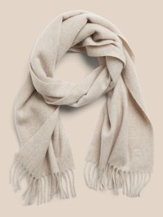 Spun from pure cashmere, this soft and warm scarf will be the one you reach for on cold days for seasons to come.  Length: 63" (160cm) Width: 12" (30. 5cm) Classic Cashmere Scarves For Fall, Classic Cashmere Shawl For Winter, Classic Winter Cashmere Shawl, Classic Beige Scarf For Fall, Classic Scarves For Cold Weather In Fall, Classic Beige Scarves For Fall, Classic Scarves For Fall And Cold Weather, Classic Cashmere Scarves, Cream Wool Scarf For Fall