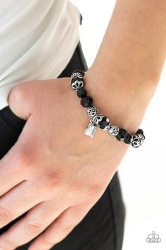 A collection of black crystal-like beads and ornate silver beads are threaded along a stretchy band around the wrist. An abstract silver heart charm swings from the center, for a romantic finish. Sold as one individual bracelet. P9WH-BKXX-176XX Squirrel Jewelry, Nickel Free Jewelry, Black Bracelet, Black B, Paparazzi Accessories, Black Bracelets, Affordable Jewelry, Red Crystals, Black Crystals