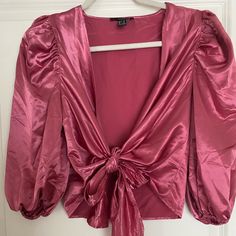 Plunging V-Neck, Satin, Front Tie Blouse. Bnwt! Features 3/4 Length Puff Sleeves. Super Cute Just Didn’t Care For The Color On Me. Glamorous V-neck Tops For Date Night, Glamorous Pink V-neck Blouse, V-neck Padded Blouse For Brunch, Trendy V-neck Blouse For Party, Glamorous V-neck Crop Top For Spring, Glamorous V-neck Crop Top For Summer, Glamorous V-neck Summer Crop Top, Padded V-neck Blouse For Night Out, Summer V-neck Blouse For Going Out