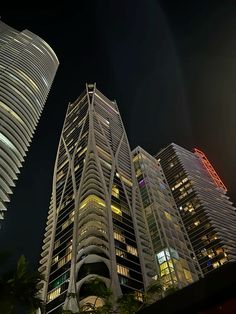 the skyscrapers are all lit up at night