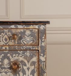 an old painted dresser with two drawers