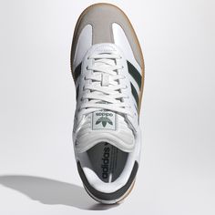 White leather sneaker from adidas Originals featuring rounded toe, green side bands, lace-up closure, logoed tongue and natural rubber high sole.Leather upper/ Rubber sole Classic Adidas Leather High-top Sneakers, Adidas Logo Leather Lace-up Custom Sneakers, Custom Adidas Logo Leather Lace-up Sneakers, Green Adidas High-top Lace-up Sneakers, Adidas High-top Leather Sneakers, High-top Leather Adidas Sneakers, Green Lace-up High-top Sneakers With Adidas Logo, Sporty Skate Shoes With Gum Sole And Round Toe, Green High-top Adidas Sneakers With Round Toe