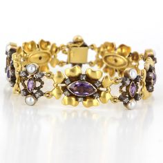 Flower Cocktail Bracelet Overview: Offered for sale is a truly superb art deco cocktail bracelet (circa 1920s-1930s), crafted beautifully in 18 karat yellow gold. The flower designed bracelet features an estimated .50 carat rose cut diamonds, 4.85 carat estimated amethyst and 3mm cultured pearls. Bracelet measures 7 1/2 inches in length. The vintage bracelet is in excellent condition. Particulars: Weight: 35.8 grams Stones: 52 approx. .50 carat rose cut diamonds (estimated I-J in color and I3 in Elegant Amethyst Bracelet For Anniversary, Elegant Amethyst Bracelets For Anniversary, Yellow Gold Amethyst Bracelet, Gold Amethyst Bracelets For Formal Occasions, Elegant Jeweled Yellow Gold Bracelet, Elegant Multi-stone Diamond Bracelet, Luxury Yellow Gold Amethyst Bracelets, Jeweled Yellow Gold Bracelets For Formal Occasions, Yellow Gold Jeweled Bracelet For Formal Occasions