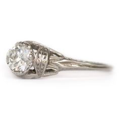 VIEW A VIDEO OF THIS RING https://youtu.be/Qmahlguln0E Description: Beautiful and simply elegant! This piece is a 1930s Art Deco style Platinum engagement ring featuring a GIA Certified 0.48ct Round Brilliant cut center diamond! Gorgeous designs on filigree encompass this ring with floral-like and sharp definition of shapes. They are bold and create immense texture to be seen without having to look closely. It is in amazing condition and truly timeless! This is a true antique piece, and we are h Classic Engraved Ring With Center Stone, Heirloom Solitaire Ring With Classic Cut, Classic Engraved Ring With Brilliant Cut Round Band, Classic Engraved Ring With Brilliant Cut, Classic Diamond White Engraved Ring, Classic Engraved Ring With Brilliant Round Cut, Classic White Gold Engraved Ring With Diamond Cut, Classic Engraved Ring In Diamond White With Round Cut, Classic Platinum Ring With Round Band