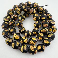 An excellent strand of antique bicone Venetian king beads in a rare smaller size separated with small copper rings from Ethiopia. 43 beads 22" of beads 56cm 11 to 12mm diameter 1.5mm hole Traditional Rondelle Large Beads, Ceremonial Large Spiritual Beads, African Trading Beads, Traditional Large Brown Beads, Antique Oval Beads, Antique Round Spacer Beads, Ancient Glass Beads, Antique Hand-strung Oval Beads, Hand-strung Antique Oval Beads