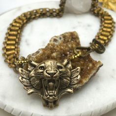 I designed and created this piece using:  1.Vintage bookchain necklace, this is heavy and large in scale; 2. Large carved gold tone rings to connect; and  3. Large brass lion/tiger  pendant  Pendant Size: 3" x 2" Chain measurement 1" wide x 1/4"  Wearable Length: 20" 🌺ABOUT KIKIBLOOMS My one-of-a-kind designs are thoughtfully curated vintage and antique pieces that honor their past while highlighting their original beauty. As with most vintage pieces that have been preloved, there can be natura Tiger Pendant, Lion Tiger, Be Natural, Curated Vintage, Favorite Jewelry, Necklace Etsy, Jewelry Necklace Pendant, Lion, Heavy Duty