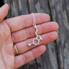 Serotonin necklace -  the neurotransmitter of joy, relaxation, and well-being. Dopamine Serotonin, Serotonin Necklace, Organic Chem, Nerdy Jewelry, Molecule Necklace, Science Jewelry, Jewelry Display Case, Funky Jewelry, Beautiful Necklace