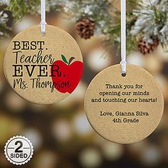 two christmas ornament hanging from a tree with the words best teacher ever and an apple