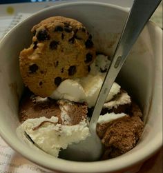 a bowl filled with ice cream and chocolate chip cookies