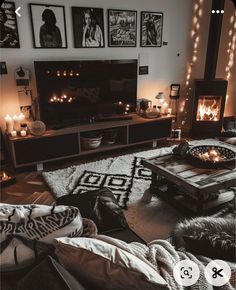 a living room with candles and pictures on the wall