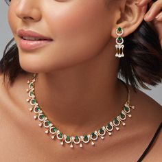 Description: This stunning necklace from our CZ collection showcases a beautiful mix of white and green CZ stones in a sophisticated design. Finished with gold plated- base, it adds a polished touch to any outfit. Whether as a gift or for special occasions, this necklace blends timeless elegance with modern style. Details & Specification: Materials used: Brass Alloy with Gold & White Gold Plating Weight - Necklace- 23 gm, Earrings- 6 gm Length - Necklace- 10 cm, Earrings- 3.5 cm Make it custom: Elegant Green Kundan Necklace For Anniversary, Green Fine Jewelry Bridal Necklace For Celebration, Gold Emerald Necklace For Celebration, Green Bridal Necklace Fine Jewelry, Fine Jewelry Green Bridal Necklace For Celebration, Green Bridal Necklace For Celebration, Luxury Green Necklaces With Sparkling Stones, Dazzling Green Stone Necklaces, Dazzling Green Diamond Necklace For Gift