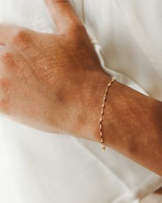 Light up your bracelet stack with a glowing string of solid gold: a high-shine staple you can put on…and leave on forever. Available in an adjustable 6.25-7.25" length or a custom length to fit any wrist! 10k solid gold is:- more durable and scratch-resistant than 14k- made for a lifetime of 24/7 wear- nearly indistinguishable from 14k in color and shine- able to be polished and refinished indefinitely- waterproof and sweat-proof—just no chemicals, please! We even wrote a journal about why 10k i Adjustable Dainty 14k Gold Name Bracelet, Dainty 14k Gold Name Bracelet With Adjustable Chain, Dainty Adjustable Name Bracelet For Formal Occasion, Adjustable Rose Gold 14k Gold Filled Bracelet, Adjustable 14k Rose Gold Filled Bracelet, Adjustable 14k Rose Gold-filled Bracelet, Adjustable Delicate 14k Gold Bracelet, Elegant Adjustable 14k Gold Paperclip Bracelet, Delicate Adjustable 14k Gold Bracelet