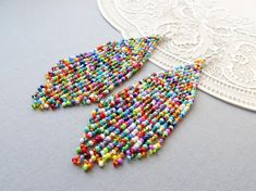 Multicolored fringe earrings Tassel earrings Long Colorful beaded earrings American Indian style jew Rainbow Beaded Fringe Earrings For Gift, Rainbow Fringe Earrings As Gift, Multicolor Fringe Chandelier Earrings For Gift, Multicolor Beaded Fringe Earrings For Party, Multicolor Fringe Beaded Drop Earrings, Multicolor Fringe Beaded Earrings With Round Beads, Multicolor Fringe Dangle Earrings, Multicolor Beaded Fringe Drop Earrings, Multicolor Beaded Tassel Earrings For Party