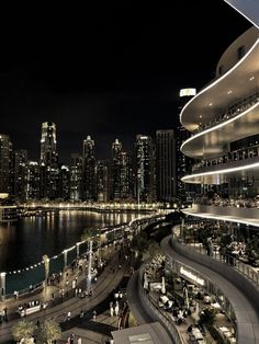 the city skyline is lit up at night