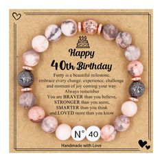 the happy birthday bracelet is made with pink and white marble beads, which are accented with