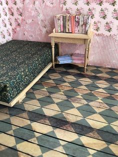 a doll house bedroom with checkered floor and pink wall paper on the back wall