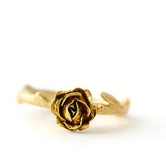 Yellow Gold Rose Ring, Flower Engagement Ring, Solid Gold Ring For a romantic engagement ring look no further than this classic Rose design. The design features an open handmade fair-trade gold rose supported by a smooth stem. * Material: 9ct Fair-trade Gold (Choose from Yellow, Red or White) * Size of Rose: Approx. 0.8cm (0.3in) diameter and 0.4 cm (0.16 in) height * Made to order * Ready to Ship in 10 business day * Made in the United Kingdom Please allow for slight variations in size as every Elegant Floral Rings With Rose Details, Elegant Rose Design Promise Ring, Dainty Rose Design Flower Ring For Anniversary, Elegant Promise Ring With Roses Detail, Delicate Rose-colored Anniversary Rings, Elegant Promise Ring With Rose Design, Elegant Rose Detail Rings For Anniversary, Elegant Wedding Rings With Rose Details, Elegant Wedding Rings With Roses Design