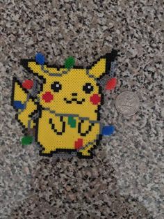 a pokemon pin sitting on top of a stone floor