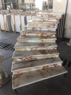 marble stairs are lined up in a warehouse