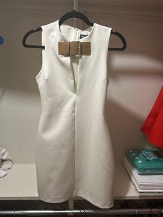 White buckle front dress from Zara, never worn, minimal stretch Luxury Zara Asymmetrical Dress, Zara Luxury Sleeveless Mini Dress, Zara Dresses With Button Closure, Chic Formal Mini Dress With Belt, Chic Fitted Mini Dress With Belt, Fitted Mini Dress With Belt For Work, Tailoring Dress, Zara White, Zara Dresses