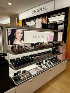 a display in a store filled with lots of beauty products and cosmetics on it's shelves