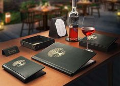 a table topped with books and glasses of wine