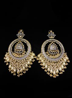 Russu - Amrapali Indian Cluster Pearl Earrings with Kundan stones Amrapalli Indian bridal earrings made with hammered metal and plated with gold. This luxurious Kundan stone stud setting makes this earring jewelry one of a kind. Gorgeous cluster pearls adorn this piece adding grace to this jewelry piece. Mini pearl drops enhance this piece making it perfect to be paired with any of your ethnic wear. Approximate earrings 3.5" Details: Handcrafted Metal: Metal Alloy, Gold Plated Stone: Kundan &amp Elegant Stone Work Danglers For Diwali, Festive Fusion Style Gold Hoop Earrings, Gold Fusion Hoop Earrings For Festive Season, Festive Fusion Gold Hoop Earrings, Festive Metal Temple Jewelry Earrings, Elegant Danglers With Stone Work For Reception, Elegant Metal Chandbali Bridal Earrings, Gold Fusion Hoop Earrings With Latkans, Elegant Chandbali Bridal Earrings In Metal