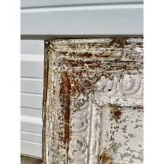 an old door is covered in rust