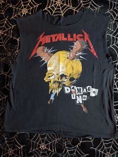 Vintage Metallica Damage Inc shirt. Cool Pushead art on the front and back. I purchased this shirt in the late 80's at a local record shop. It's been in storage for 20+ years. Sleeves and neck have been cut out. The hem on the back has some stitching gone. See pics for exact measurements. Shipped USPS Priority with insurance. Metallica Shirt Outfit, Band Tee Aesthetic, Pushead Art, Vintage Metallica Shirt, Band Clothes, Vintage Rock T Shirts, Vintage Band T Shirts