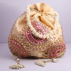 Wholesale Joblot Pack Of 25 Golden Gota Patti Work Hand Embroidered Indian Potli  Women Handbag Wedding Give AwaysMaterial:Silk, Golden Lace, Thread, Golden Metallic WireColor: GoldenPackage Contents: 25Size: 10" x 8"Designed with the heart, this beautiful Potli or batawa bag are eye catchy and made of premium material.Key Features:Embroidery art work. (zardosi work).This potli is good match with both Indian and western outfits and are superb for wedding and festive parties.This would be best co Gold Embroidered Pouch For Celebration, Gold Embroidered Celebration Pouch, Festive Embroidered Beige Bags, Gold Potli Bag With Gota Work For Reception, White Embroidered Bag For Reception, White Embroidered Bags For Reception, Cream Embroidered Wedding Bags, Cream Pouch Bag For Wedding, White Embroidered Wedding Bag