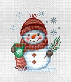 a cross stitch snowman with a red hat and scarf holding a green plant in his hand