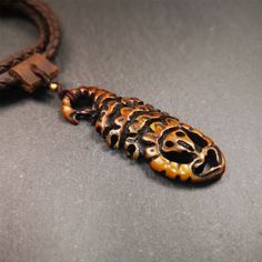 ❤This unique bone carved Scorpion Guru pendant is made by Tibetan craftsmen in Hepo Township, Baiyu County, the birthplace of the famous Tibetan handicrafts.It's carved yak bone,brown color,2.2 inch height.You can make it into necklace,or mala pendant.❤Details Material:yak bone Size: Height:56mm / 2.2 inches Width: 22mm / 0.87 inches ❤Free Gift : Cowhide Cord Color:brown Length:68cm / 26.8inches Width:4mm / 0.16inches You'll get 1 * scorpion pendant as pictures shown. Clay Scorpion, Beaded Scorpion, Scorpion Accessories, Scorpion Wood Carving, Ceremonial Carved Amulet Jewelry, Color 2, Scorpion, Yellow Color, Brown Color